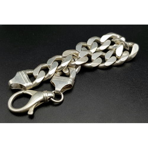 653 - A Chunky Stylish Solid Silver 925 Curb Chain Bracelet, 64.5 grams, 21.5cm. Signs of wear but In very... 