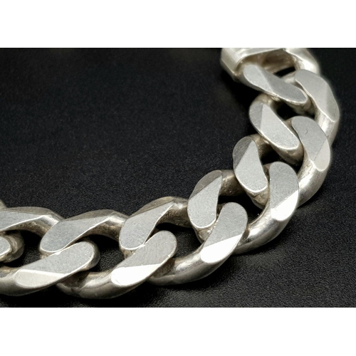 653 - A Chunky Stylish Solid Silver 925 Curb Chain Bracelet, 64.5 grams, 21.5cm. Signs of wear but In very... 