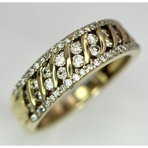 677 - A 9K YELLOW GOLD DIAMOND BAND RING. 0.30CT. 3.2G IN WEIGHT. SIZE O. Ref: SC 5004.