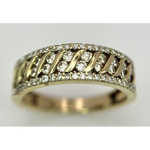 677 - A 9K YELLOW GOLD DIAMOND BAND RING. 0.30CT. 3.2G IN WEIGHT. SIZE O. Ref: SC 5004.