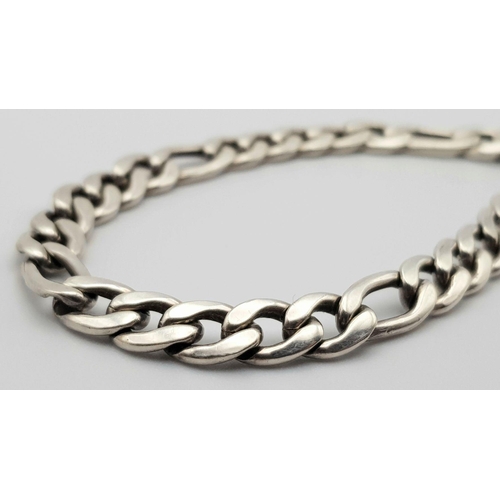 908 - An appealing Solid Silver 925 Figaro Chain Bracelet with Heart Padlock and safety chain, 17.2grams, ... 