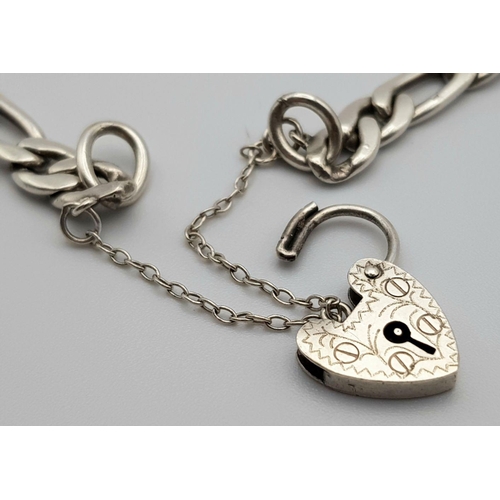 908 - An appealing Solid Silver 925 Figaro Chain Bracelet with Heart Padlock and safety chain, 17.2grams, ... 