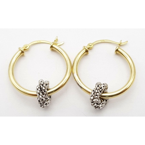 994 - A 9K YELLOW GOLD HOOP EARRINGS WITH WHITE GOLD TWIST ADD ONS. 2G IN WEIGHT. 2CM DIAMETER. Ref: SC 50... 