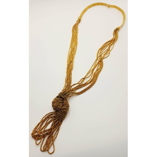 989 - An Aurelie Bidermann Gilded Statement Decorative Knot Necklace. 70cm