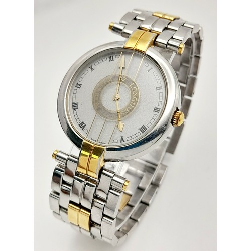 985 - A Longine Rodolph Quartz Gents Watch. Two tone bracelet and case - 33mm. Silver tone dial. In workin... 