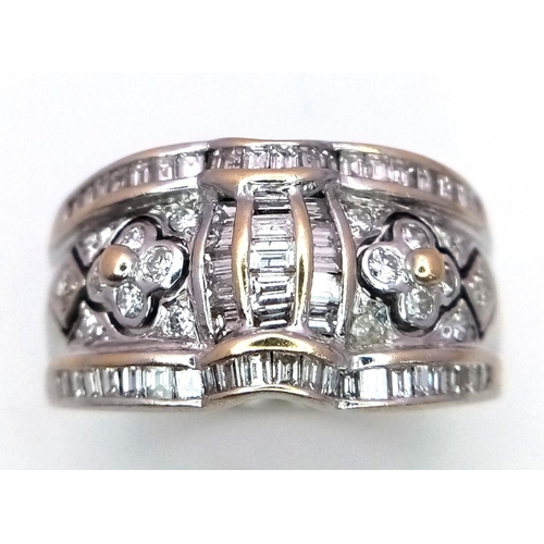 935 - An 18K White Gold Decorative Diamond Ring. Seventy Round and rectangular cut diamonds create an arti... 