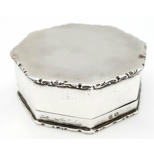 1174 - An Antique Octagonal Sterling Silver Pill Box. Ornate sides. 
7.5cm at base. 3cm tall. Hallmarks for... 