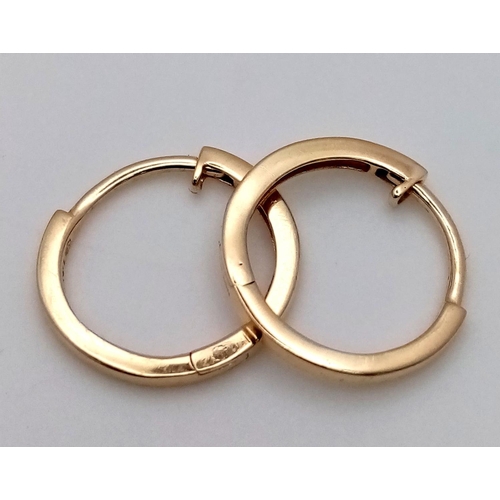 990 - A Pair of Designer Massika 14K Yellow Gold Small Hoop Earrings. 0.8g total weight.