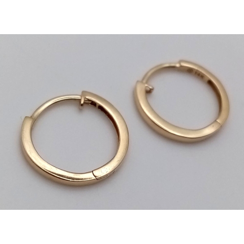 990 - A Pair of Designer Massika 14K Yellow Gold Small Hoop Earrings. 0.8g total weight.