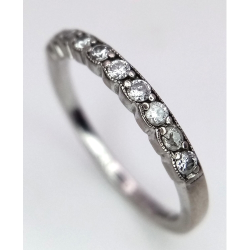 1052 - A Brown's Designer 18K White Gold and Diamond Half Eternity Ring. Size M. Comes with a Browns box. 2... 