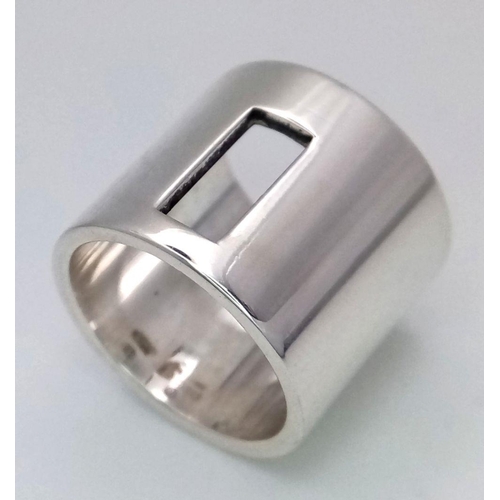 954 - A Gucci Designer Sterling Silver Ring. Size K. 16mm width. 13.5g