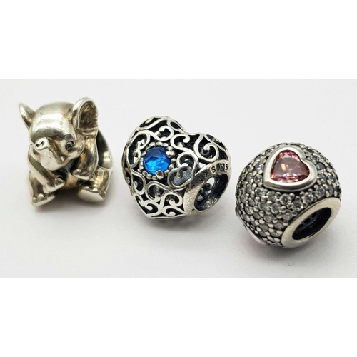 1090 - Three pandora sterling silver bead charms (round, heart and elephant shaped), total weight: 8.3 g.