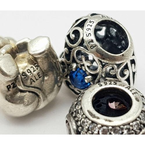 1090 - Three pandora sterling silver bead charms (round, heart and elephant shaped), total weight: 8.3 g.