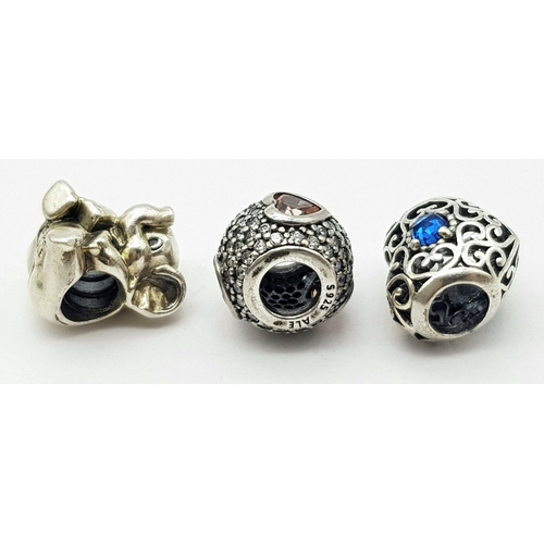 1090 - Three pandora sterling silver bead charms (round, heart and elephant shaped), total weight: 8.3 g.