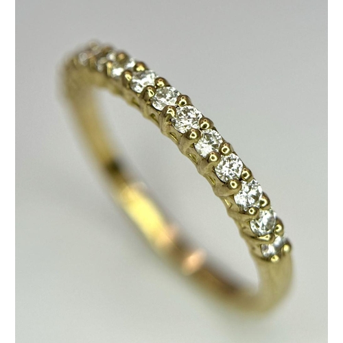 1535 - A 9K Yellow Gold Half Eternity Diamond Ring. Size M/N, 1.57g total weight.