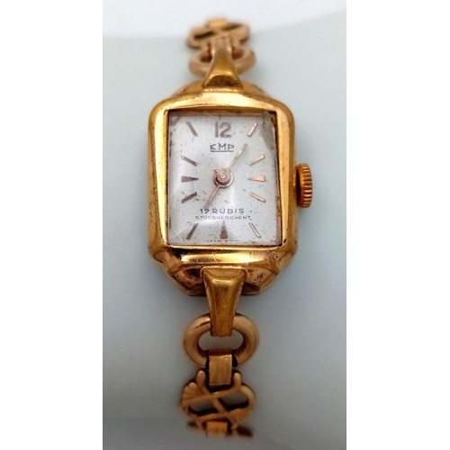 1111 - A vintage ladies EMP gold plated watch, case 21 x 15 mm, manual movement 17 rubies. Chip on glass fa... 