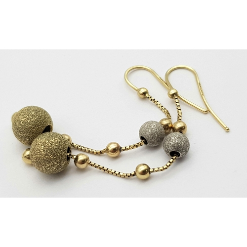 761 - A Pair of 9K Yellow Gold Glitterball Drop Earrings. 5cm drop.
3g total weight.