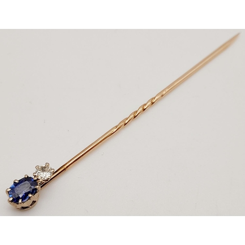 814 - A Vintage 9K Gold Diamond and Sapphire Stick Pin. 7cm. 1.4g total weight.