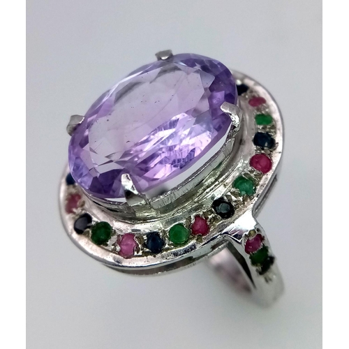 747 - An Amethyst Ring with Multi-Coloured Sapphire Surround. 925 silver. Ring size Q/R, 10g total weight.... 