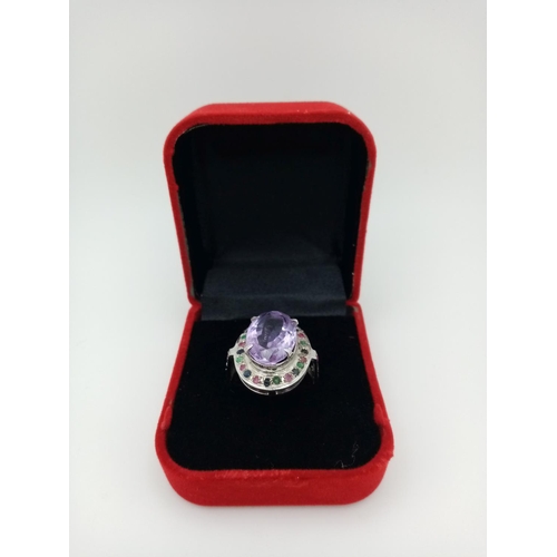 747 - An Amethyst Ring with Multi-Coloured Sapphire Surround. 925 silver. Ring size Q/R, 10g total weight.... 