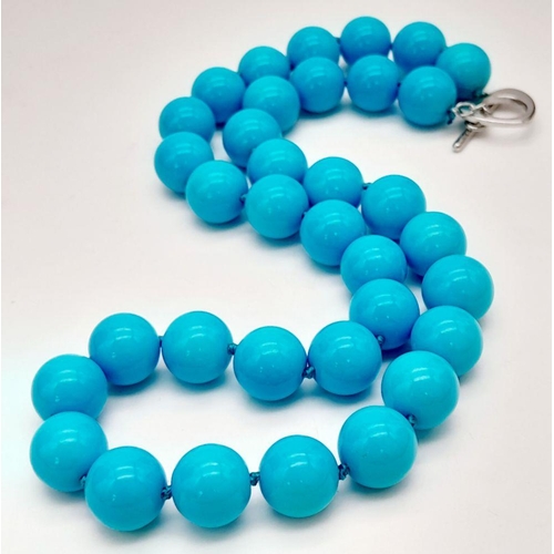 807 - A Sky-Blue Coloured South Sea Pearl Shell Beaded Necklace. 12mm beads. 42cm necklace length.