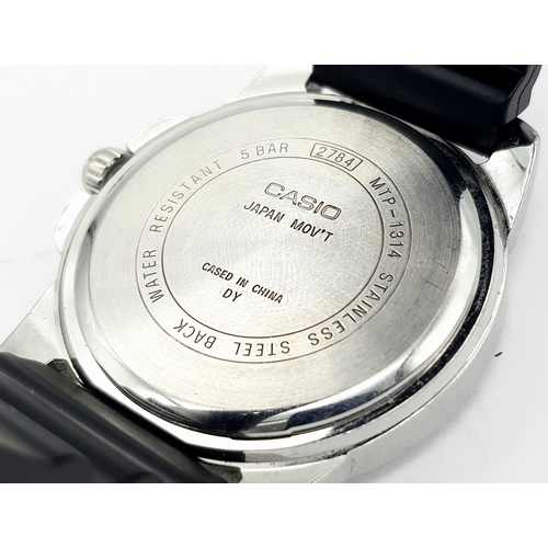 921 - A Casio Quartz Analogue Gents Watch. Black rubber strap. Stainless steel case - 43mm. Black dial wit... 