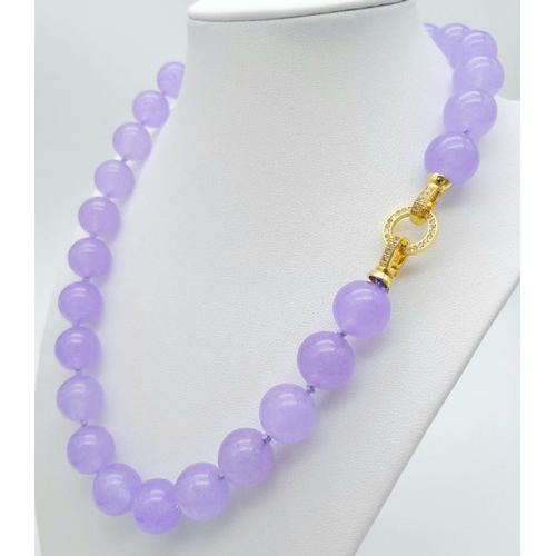 572 - A Vibrant Lavender Jade Large Beaded Necklace with Gilded Clasp. 14mm beads. 42cm necklace length.