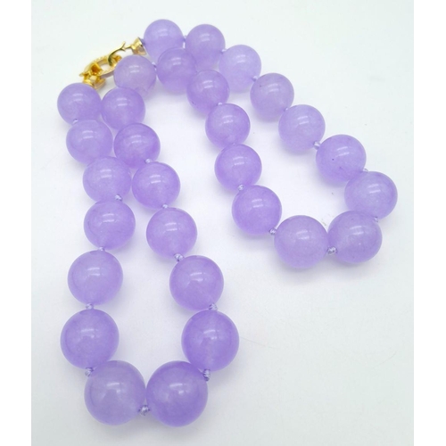 572 - A Vibrant Lavender Jade Large Beaded Necklace with Gilded Clasp. 14mm beads. 42cm necklace length.