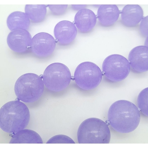 572 - A Vibrant Lavender Jade Large Beaded Necklace with Gilded Clasp. 14mm beads. 42cm necklace length.