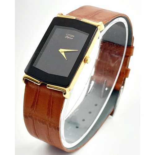 821 - A Citizen Elegance Ladies Quartz Slim Watch. Brown leather strap. Gilded case - 23mm. Black dial. In... 