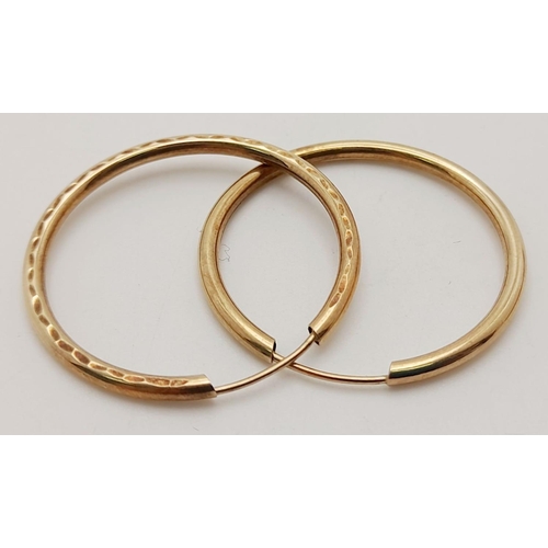 703 - A Pair of 9K Yellow Gold Hoop Earrings. 1.2g