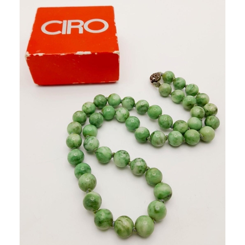 569 - An Antique Jade Necklace with Silver Clasp. 12mm diameter beads, 64.5cm length, 134g total weight.