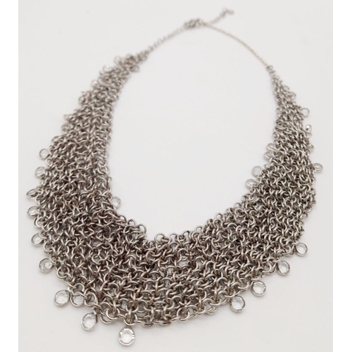 792 - AN ELEGANTLY SHAPED SILVER AND CRYSTAL CHOKER NECKLACE BT 