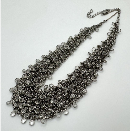 792 - AN ELEGANTLY SHAPED SILVER AND CRYSTAL CHOKER NECKLACE BT 