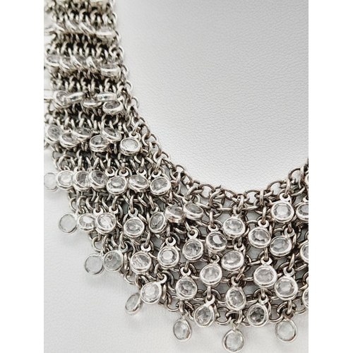 792 - AN ELEGANTLY SHAPED SILVER AND CRYSTAL CHOKER NECKLACE BT 