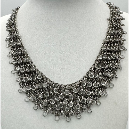 792 - AN ELEGANTLY SHAPED SILVER AND CRYSTAL CHOKER NECKLACE BT 