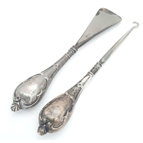 1545 - A Silver Handled Shoe Horn and Silver Handled Button Hook. 18.4cm and 18.9cm length. 95g total weigh... 