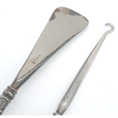 1545 - A Silver Handled Shoe Horn and Silver Handled Button Hook. 18.4cm and 18.9cm length. 95g total weigh... 