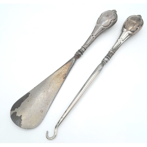 1545 - A Silver Handled Shoe Horn and Silver Handled Button Hook. 18.4cm and 18.9cm length. 95g total weigh... 