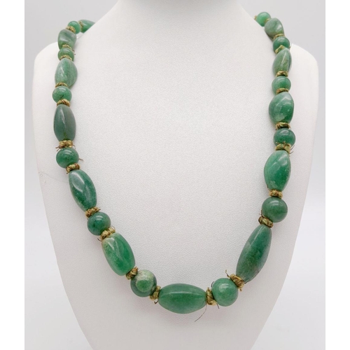 1473 - A Wonderful Antique Chinese Green Jade Necklace. 52cm. No clasp - overhead fit. Various bead sizes.