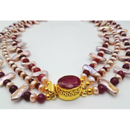 119 - A magnificent three string necklace with long (Biwa) and round pink cultured pearls and round rubies... 