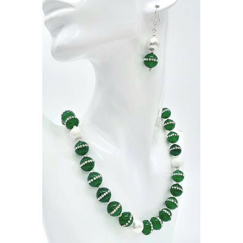 133 - A very elegant, sophisticated and uniquely created, green jade necklace and earrings set, adorned wi... 