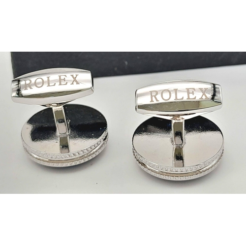 147 - A rare pair of ROLEX cufflinks. With the logo on blue surface, double milled edges, and the word ROL... 