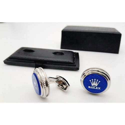 147 - A rare pair of ROLEX cufflinks. With the logo on blue surface, double milled edges, and the word ROL... 