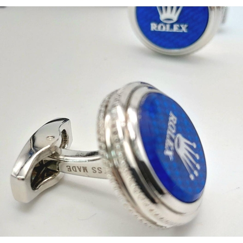 147 - A rare pair of ROLEX cufflinks. With the logo on blue surface, double milled edges, and the word ROL... 