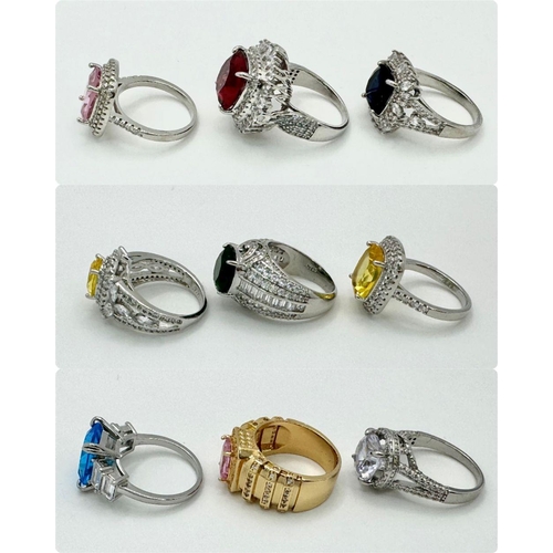 154 - A very eclectic collection of nine glamorous dress rings. All size N-O. Presented in an engraved cry... 