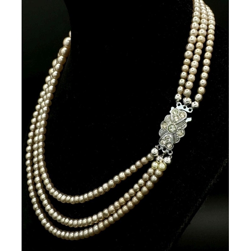 189 - A top-quality, vintage, three string faux pearl necklace by POMPADOUR PEARLS “Pearls for a princess”... 