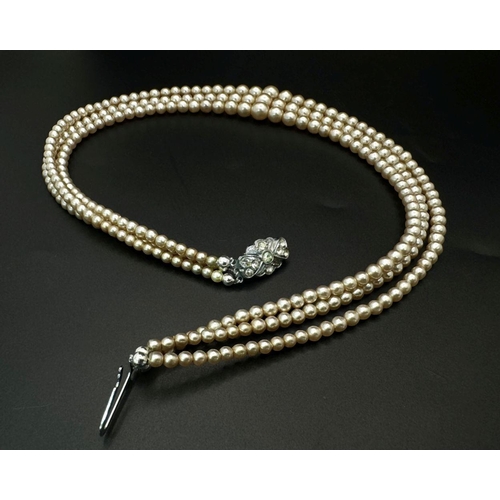 189 - A top-quality, vintage, three string faux pearl necklace by POMPADOUR PEARLS “Pearls for a princess”... 