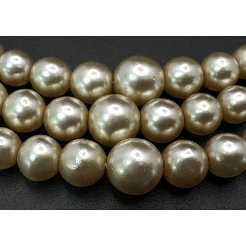 189 - A top-quality, vintage, three string faux pearl necklace by POMPADOUR PEARLS “Pearls for a princess”... 