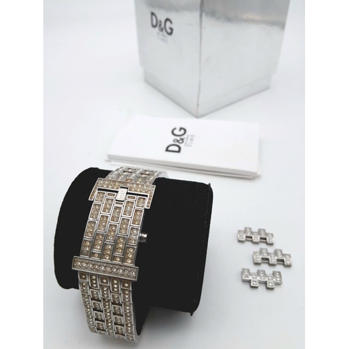 203 - An absolutely stanning, DOLCE & GABBANA TIME ladies bracelet watch, totally covered with “diamanté”,... 